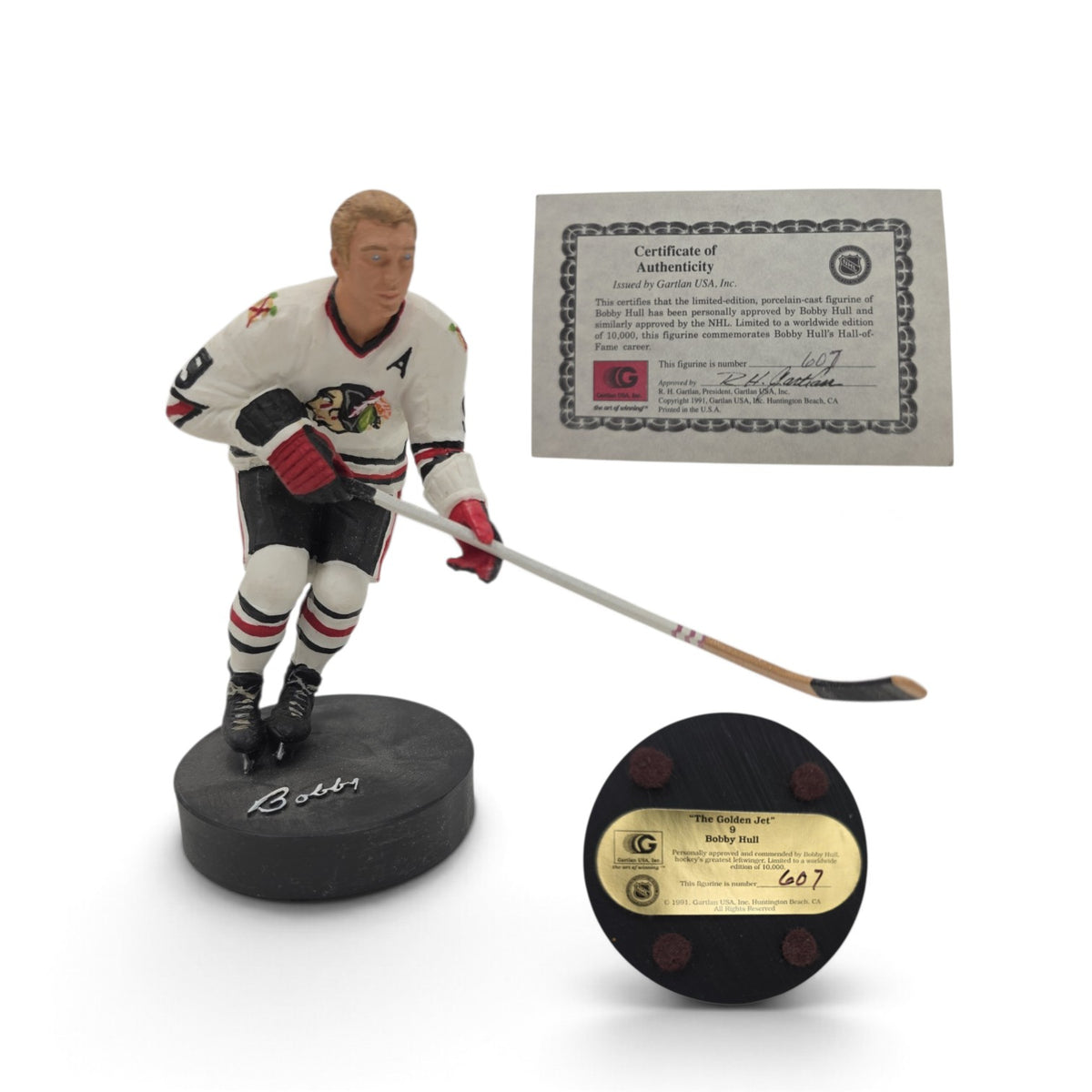 Lake Country Cards Bobby Hull porcelain hockey figurine with Certificate of Authenticity and puck-style base.