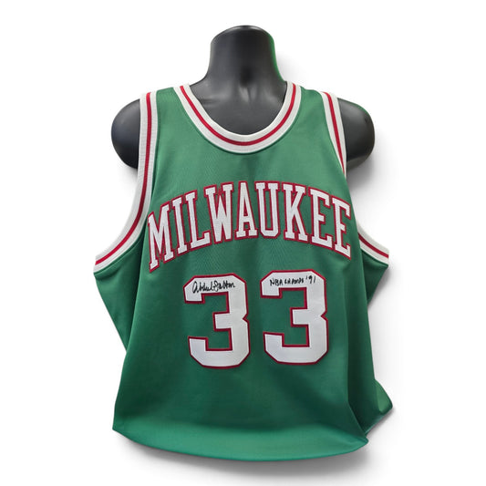 Lake Country Cards green Milwaukee basketball jersey with number 33 and signature on a mannequin